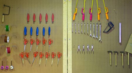 Mixed mechanic and many tools on a wood surface.の写真素材
