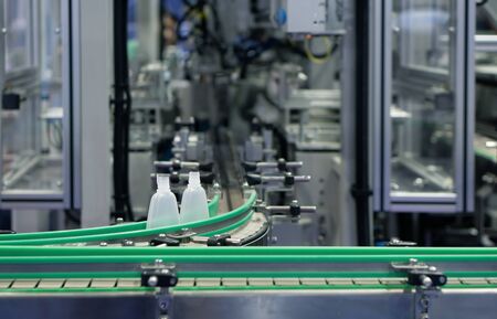 Picture of the details of the forming plastic industrial machine that is working.