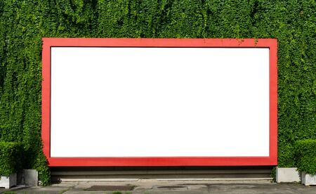 Red billboard on spring summer green leaves background.