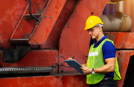 Men Industrial workers or engineers checking machine process in logistics business.