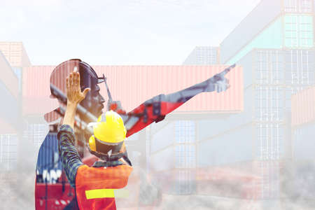 industrial worker is controlling container loading by walkie talkie in import-export business. Double exposure Style conceptの写真素材