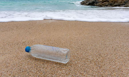 Plastic bottle waste is an environmental pollution on the beach.の写真素材