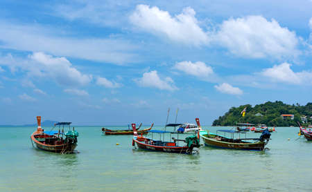 Phuket, Thailand - 06 August 2020: Fishing boats moored at Chalong Bay Pier.のeditorial素材