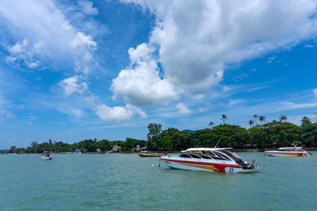 Phuket, Thailand - August 06, 2020: Group of speed boats park at Chalong Bay Pier.のeditorial素材