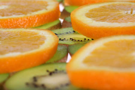 Background oranges and kiwiの写真素材