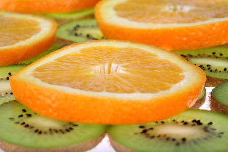 Background oranges and kiwiの写真素材