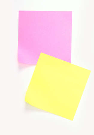yellow and pink note over white background