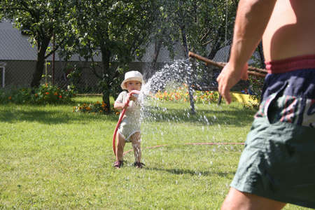 pouring grandfather boyの写真素材