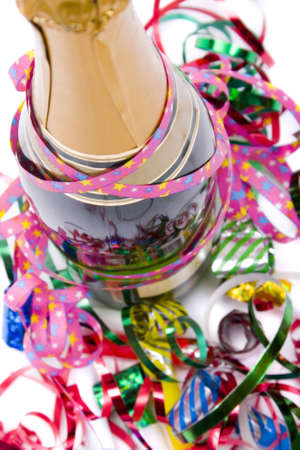 champagne bottle and glass, ribbons and blowersの写真素材