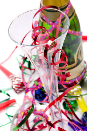champagne bottle and glass, ribbons and blowersの写真素材