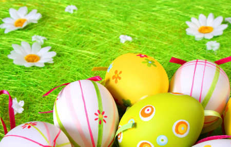 colored eggs in the grassの写真素材