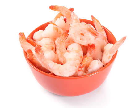 frozen prawns in orange bowl on white backgroundの写真素材