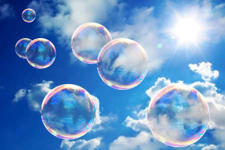 Soap bubbles on blue sky. Beauteful sunny day. Very nice color of the sky.