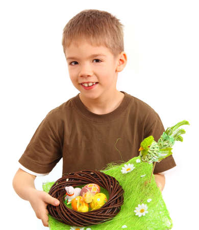 boy and easter nest full of colorful plastic eggs after an easter egg hunt