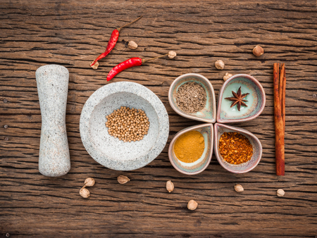 Various herbs and spices in ceramic bowl . Food and cuisine ingredients on rustic wooden  background.の写真素材
