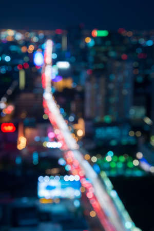 Abstract urban night light bokeh, defocused backgroundの写真素材
