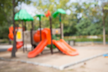 Abstract blur colorful childern playground in city park background in sunny dayの写真素材