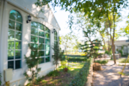 Blur image of coffee shop cafe exterior English garden country style backgroundの写真素材