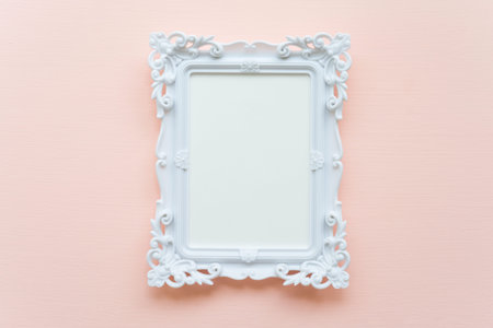 White vintage photo frame on pink pastel wooden background flat lay top view style