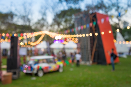 Abstract blur people in night festival city park bokeh backgroundの写真素材