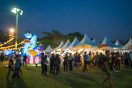 Abstract blur people in night festival city park bokeh backgroundの写真素材