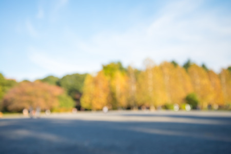 Abstract blur people in city park autumn season bokeh backgroundの写真素材