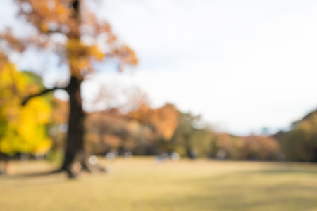 Abstract blur people in city park autumn season bokeh backgroundの写真素材