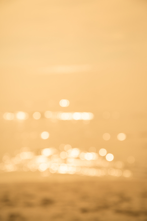 Abstract blur beautiful tropical island beach with sunlight background summer holiday conceptの写真素材