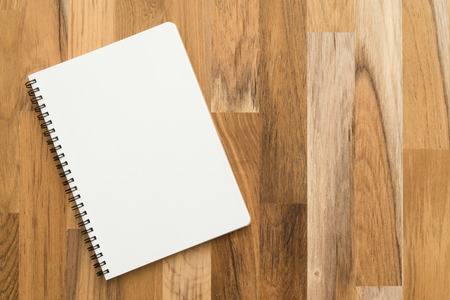 Blank empty notepad on wood tableの写真素材