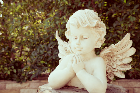Cute cupid statue  - Vintage filter effectの写真素材