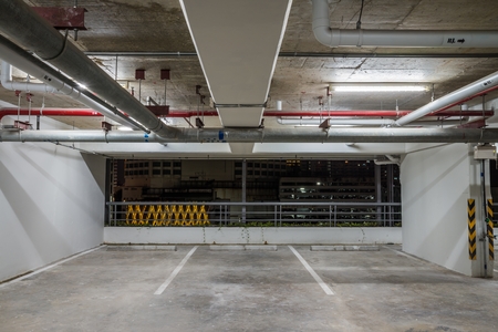 Parking garage interior neon lights in darkの写真素材