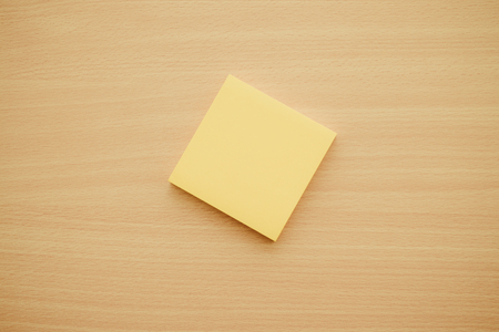 Color block of paper notes on wood table - Retro filter effectの写真素材