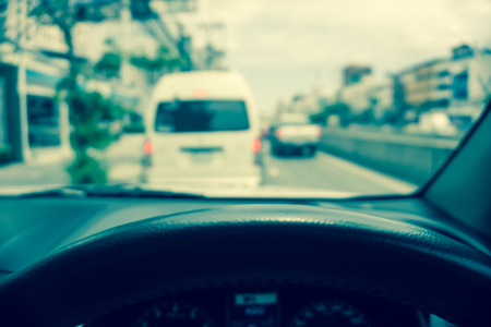 Abstract blur traffic from inside car view background - Vintage filter effectの写真素材