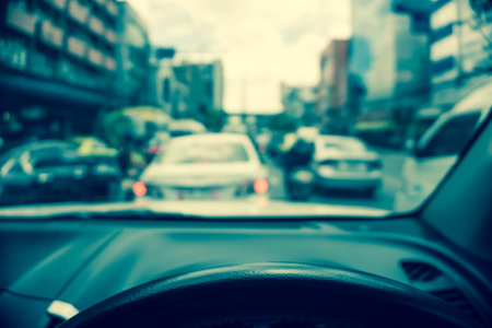 Abstract blur traffic from inside car view background - Vintage filter effect, Selective focus on...