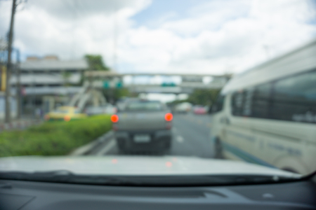 Abstract blur traffic from inside car view backgroundの写真素材