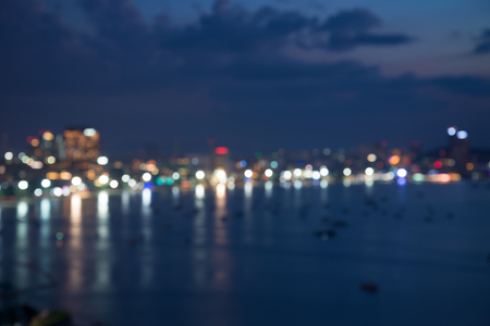 Abstract urban seaside in night light bokeh defocused backgroundの写真素材
