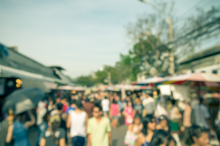 Abstract blur tourist shopping in Chatuchak weekend market outdoor in sunny day Bangkok Thailand background - Retro filter effectの写真素材