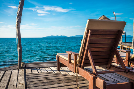 Wooden chair on beautiful tropical island Koh Mak, Trat Thailand - Selective focusの写真素材