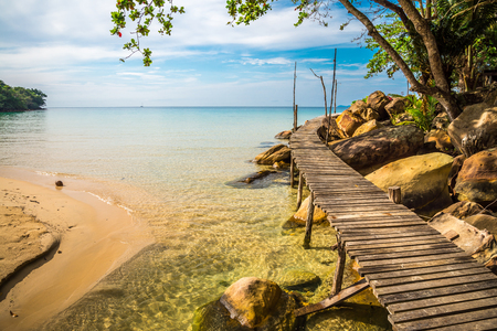 Long wooden bridge in beautiful tropical island rock beach - Koh Kood, Trat Thailandの写真素材