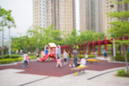 Abstract blur children playground in city park bokeh backgroundの写真素材
