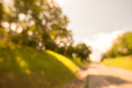 Abstract blur city park bokeh background with warm sunlight