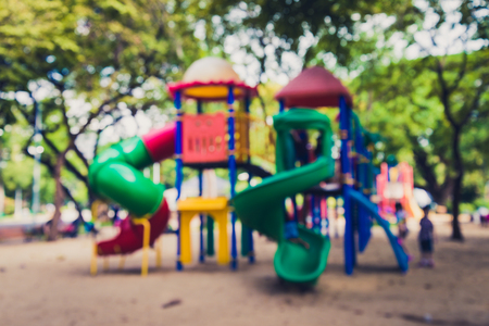 Abstract blur children playground in city park background - Vintage filter effectの写真素材