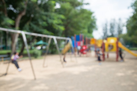 Abstract blur children playground in city park backgroundの写真素材