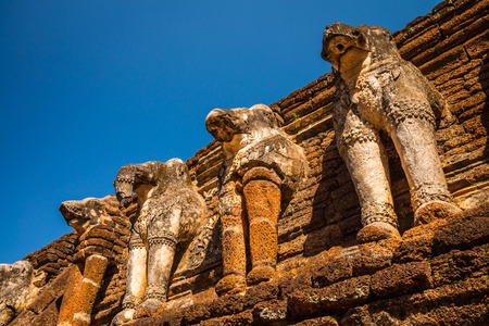 Kamphaeng Phet historical park - Elephant statue around pagoda, Thailandの写真素材