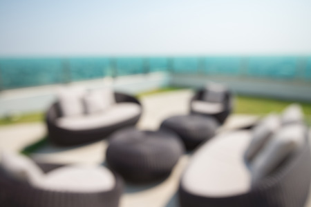 Abstract blurred background sofa set on luxury hotel rooftop in sunny dayの写真素材
