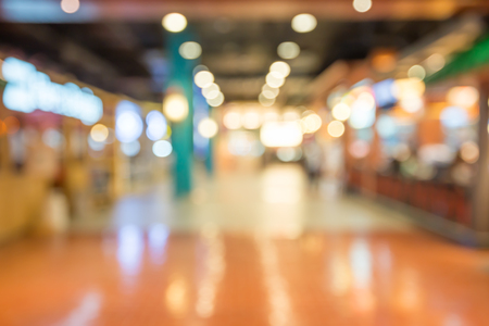 Department store shopping mall blur background with bokehの写真素材