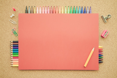 Top view of education and art supplies on cork table with empty space color paper - Retro filter effectの写真素材