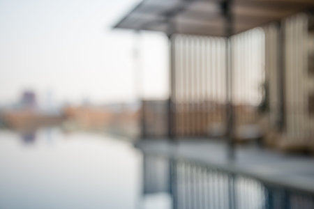 Abstract blur chair beside swimming pool background