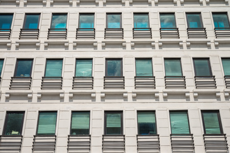 Exterior of blue glass residential building in Bangkokの写真素材