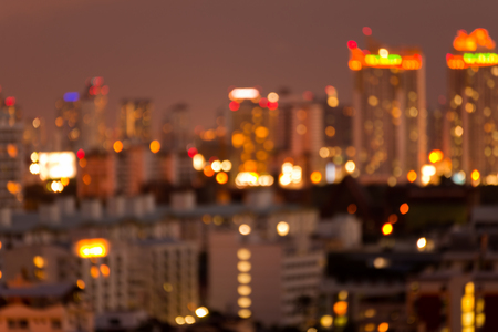 Defocused cityscape at night light golden luxury backgroundの写真素材